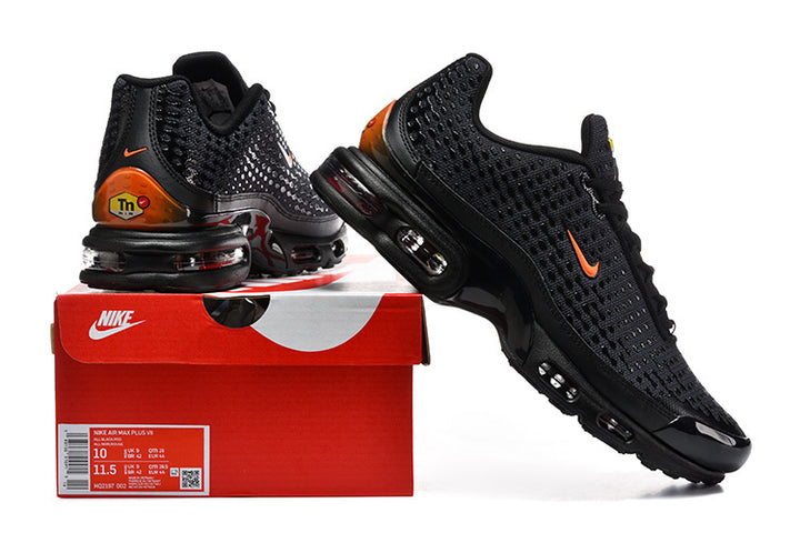 Black and orange Nike Air Max Plus VII sneakers displayed with a box showing a size label
