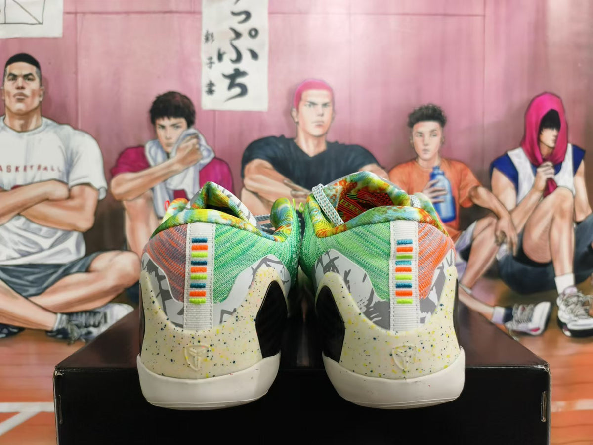 Rear view of multicolor Nike basketball shoes with patterned heel panels and striped pull tabs.