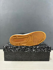 Outsole view showing the gum-colored rubber tread and circular traction pattern.