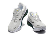 Off-white Nike Zoom Fly 6 shoes with dark green and yellow accents, viewed from the front