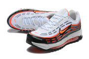 Pair of Nike sneakers shown from above and at an angle, highlighting the white laces and orange accents.