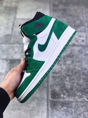 Side view showing the green heel and toe overlays, white side panel, and green outsole.