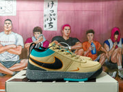 Side view of a beige sneaker with turquoise panels, black Swoosh, orange accents, and a speckled gray midsole
