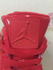 Close-up of the red tongue with an embossed basketball-player logo detail.