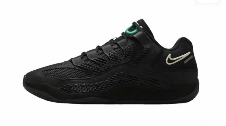 Side view of a black Nike 920-1 sneaker with textured panels, green tongue detailing, and a light-colored heel mark.