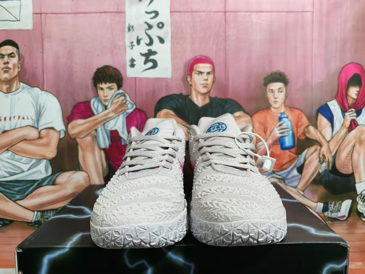 Front view of off-white Nike basketball shoes with textured uppers