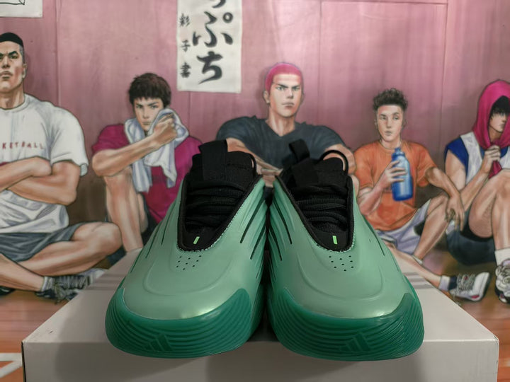 Front view of green and black sculpted sneakers with black laces.
