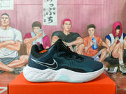 Side view of a blue and black Nike basketball sneaker with a white Swoosh, mesh upper, sculpted white midsole, and pale blue outsole.