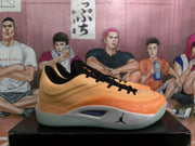 Side profile showing the orange upper, black laces, light gray midsole, and visible Jordan branding.