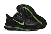 Black Nike Pegasus Premium shoe and outsole showing green accents and tread