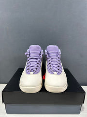 Front view of the pair showing purple tongues, laces, padded collars, and white toe boxes.