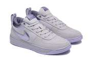 Pair of purple Nike sneakers shown from a front three-quarter angle.