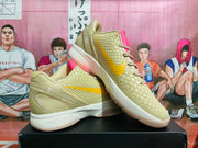 Angled view of the green Nike KD basketball shoes with pink and yellow accents