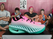 Side view of pink-to-white gradient basketball shoes with mint-green soles and black Swoosh details