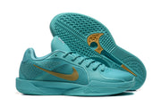 Aqua basketball shoes shown beside a view of the patterned outsole.
