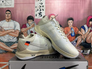 Three-quarter view of paired white Nike basketball sneakers with side swooshes, Kobe-style details and a box visibly marked KOBE.