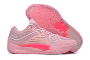 Pink Nike KD 16 shoes shown from the side and underneath, with a patterned outsole.