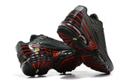 Underside and heel views of black Nike Air Max Plus sneakers