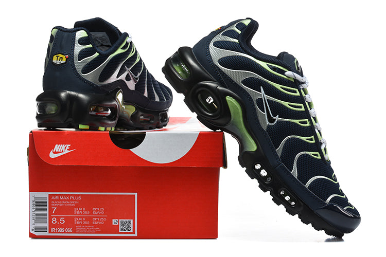 Navy Nike Air Max Plus sneakers with silver and lime-green accents displayed on a box; shoebox label visible.