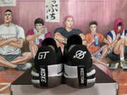 Rear view showing black heel panels, white branding details, and contrasting white midsole sections.