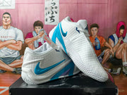 White and blue Nike basketball shoes shown together from the side and front.