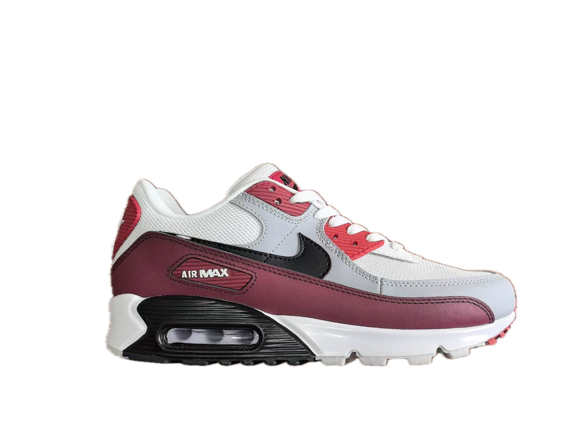 Side view of a white, burgundy and black Nike Air Max 90 sneaker