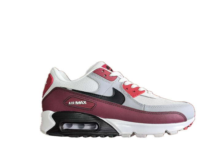 Side view of a white, burgundy and black Nike Air Max 90 sneaker