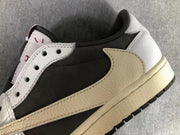 Close-up of the sneaker side showing the brown oversized Swoosh, black upper panel, white eyelet panel, and cream midsole.