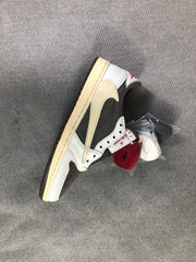 Single sneaker viewed from above with a brown oversized Swoosh and bundled replacement laces beside it.