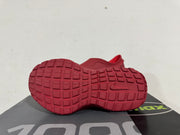 Underside of the burgundy sneaker showing the block-pattern rubber outsole and Nike swoosh.