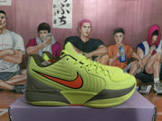 Side profile of a lime green Nike sneaker with orange and black Swoosh detailing and a patterned outsole.