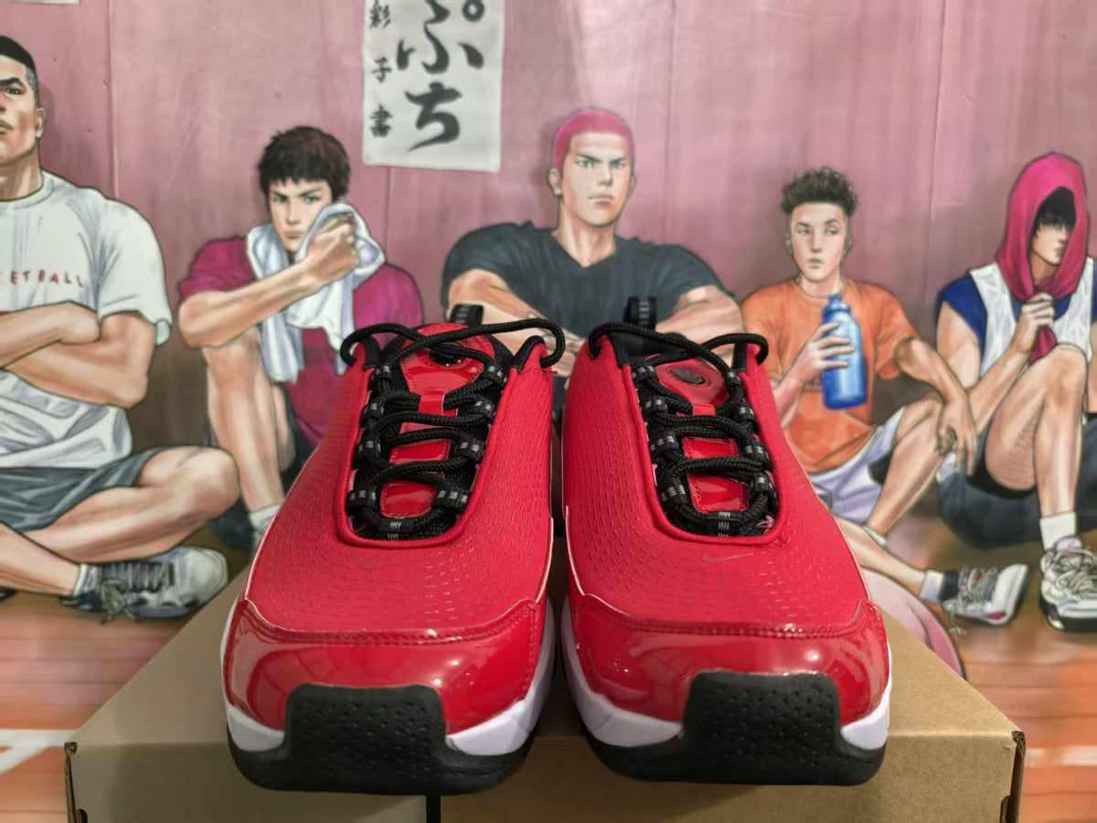 Front view of red Nike sneakers with black laces, white midsoles, and black toe details.