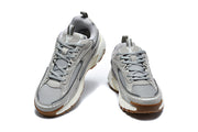 Front view of grey Louis Vuitton sneakers with mesh toe panels