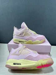Angled product view showing the pink upper, mesh side panel, pale yellow laces, heel Air unit, and outsole.