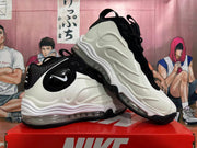 Pair of white and black Nike sneakers shown from side and three-quarter angles