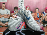 Gray Nike basketball shoes shown from the side and above, with blue and pink accents
