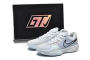 Nike GT Cut sneakers displayed in front of a black box marked GTJ.