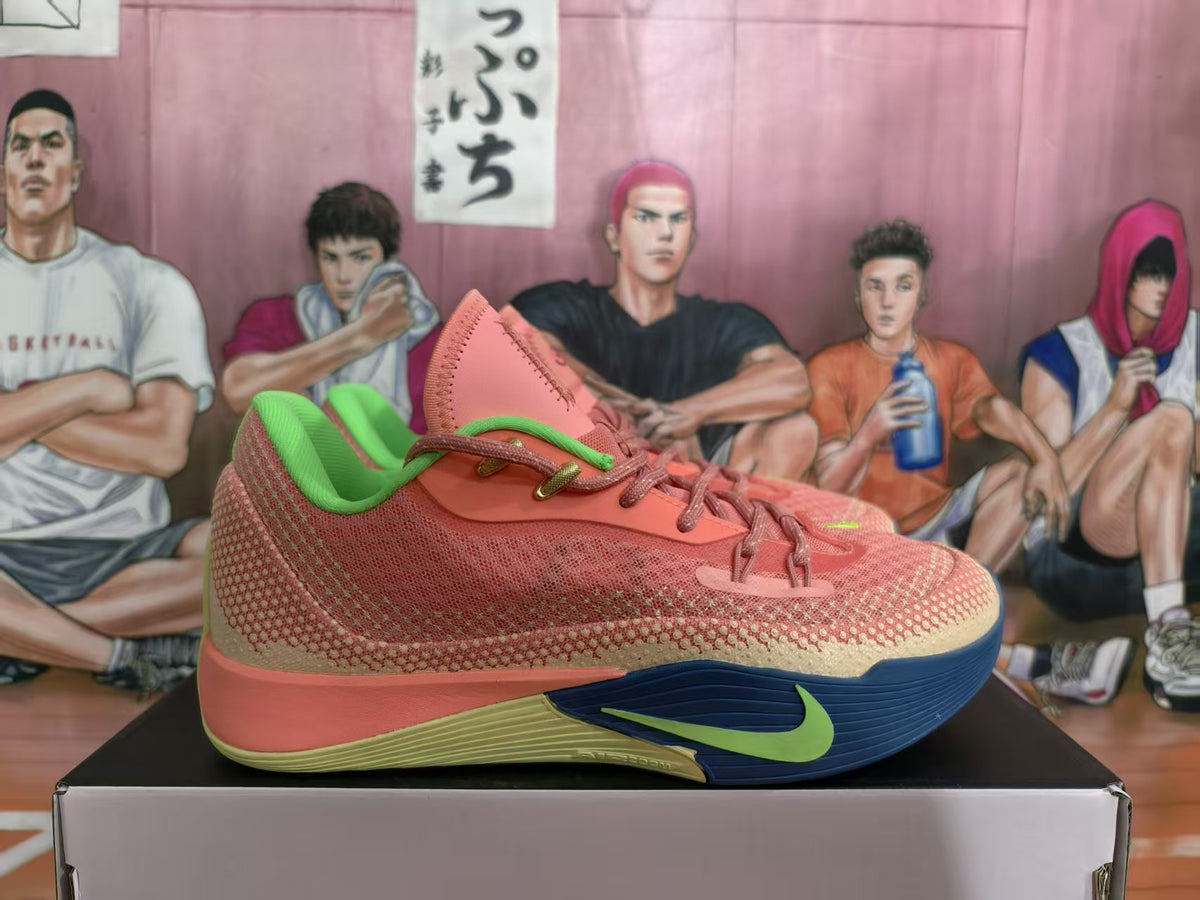 Side view of a pink Nike basketball shoe with cream patterned panels, lime-green accents, and a navy outsole