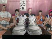 Front view showing white laces, padded tongues with visible branding, gray toe areas, and textured forefoot panels.