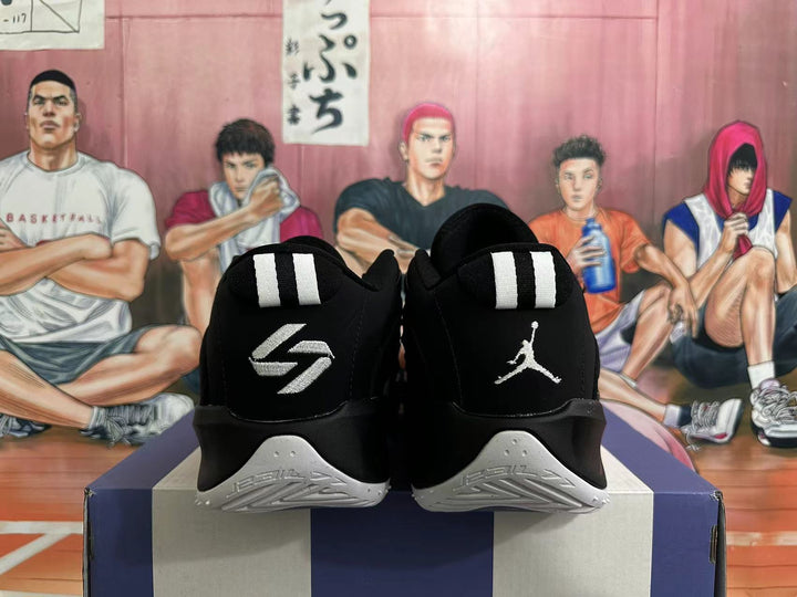 Rear view of black and grey Jordan Luka basketball shoes with contrasting heel logos