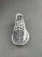 Top view showing the patterned knit toe box, tongue, and white lacing.