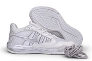White and silver Nike Sabrina 4 shoe shown beside its patterned outsole