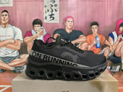 Side view of a black On Running sneaker showing the gray logo band and sculpted sole.