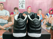 Rear view showing black padded heels, white collar trim, white outsoles and Swoosh branding.