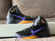 Two views of a black Nike high-top basketball shoe with purple Swoosh and gold midsole panel
