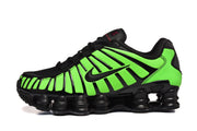 Side view of a green-and-black Nike Shox TL sneaker.