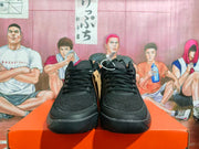 Front view of black Nike basketball shoes with laces and padded collars.