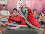 Pair of red Nike basketball shoes shown at an angle, with black and blue-green swooshes, mint-green outsoles, and speckled midsoles.