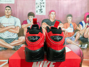 Rear view showing red heel panels, black heel sections, pull tabs, and Flight branding.