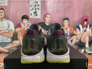 Rear view of the pair showing padded collars, dark heel panels, burgundy accents, and neon green outsoles.